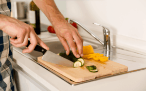 Cutting vegetables on Corian countertop GTA