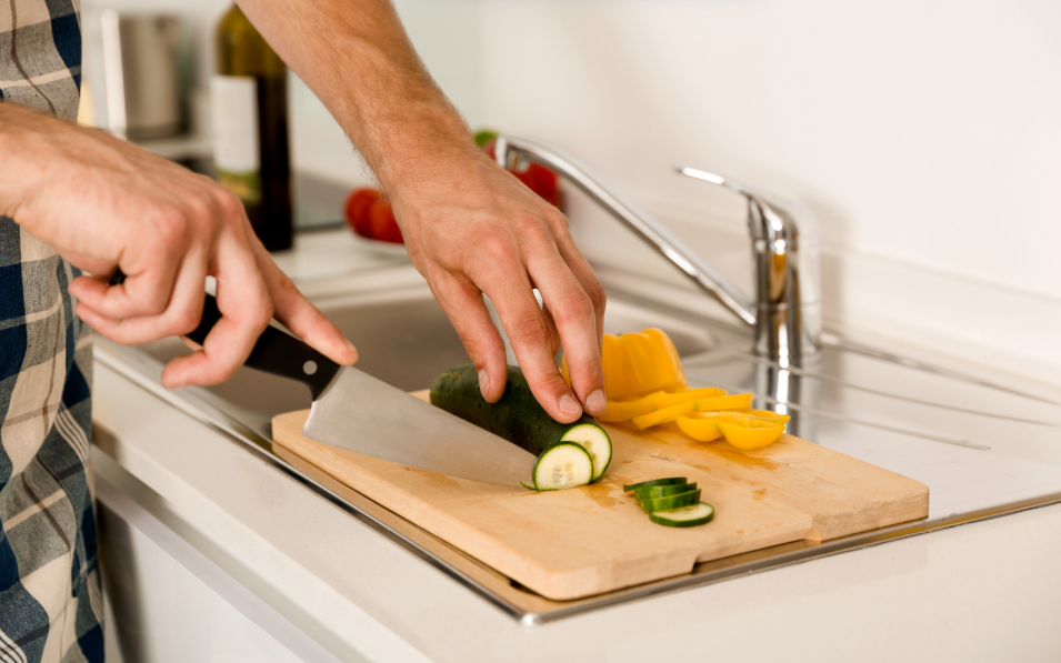 Cutting vegetables on Corian countertop GTA